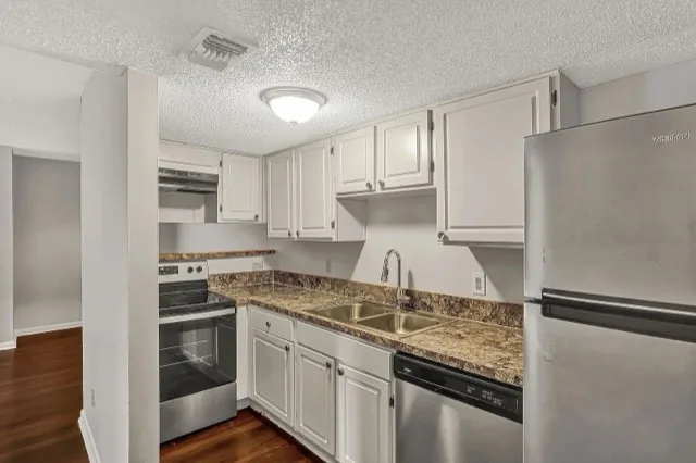 Kitchen with granite-look counters